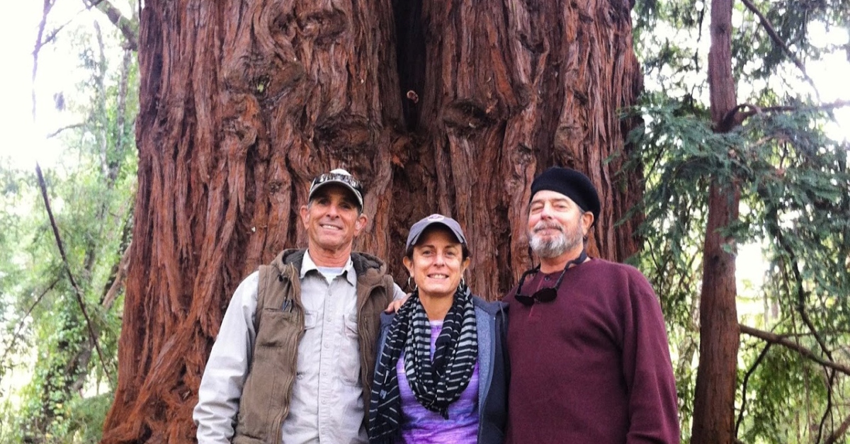 Donna Callejon stands with her brothers in front of a giant redwood in Big Basin Redwoods State Park, California.