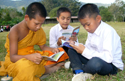 Provide books to children in villages in Laos