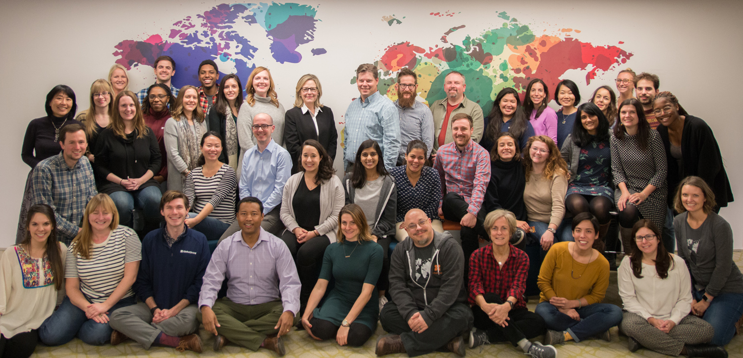 GlobalGiving staff with international flags