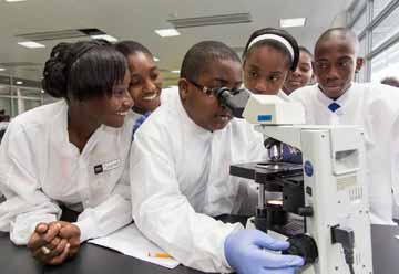 Students looking in a microscope