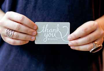 Woman Holding a Gift Card