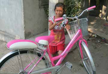 Young Girl with a Bicycle