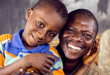 Smiling man and child