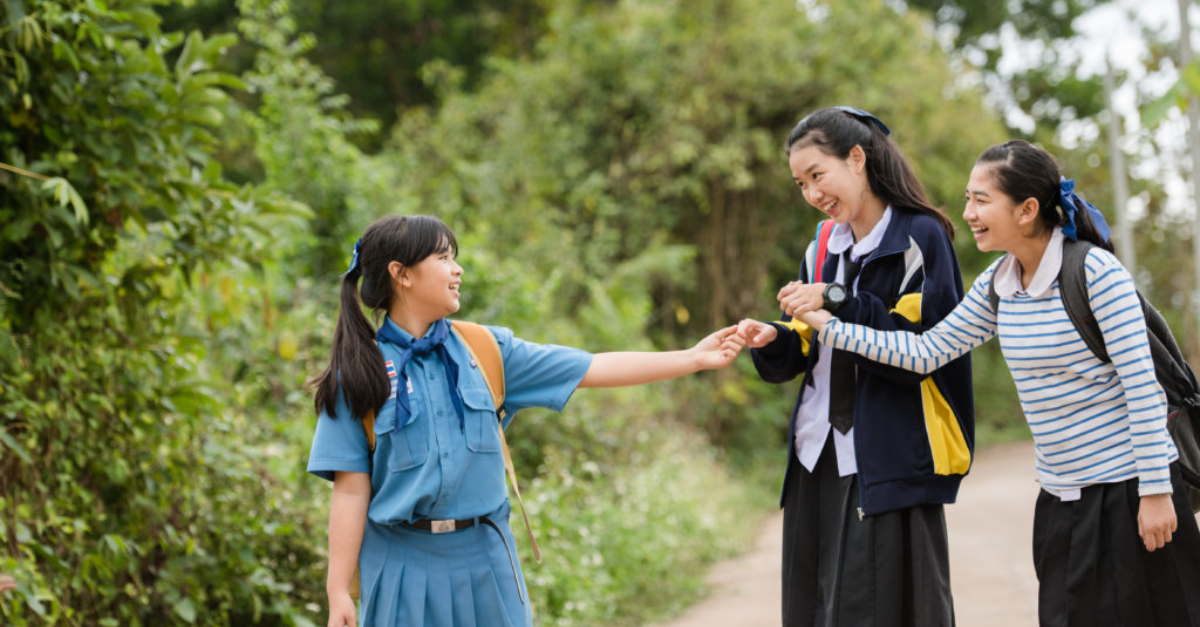 schoolgirls walk on road together radical transparency