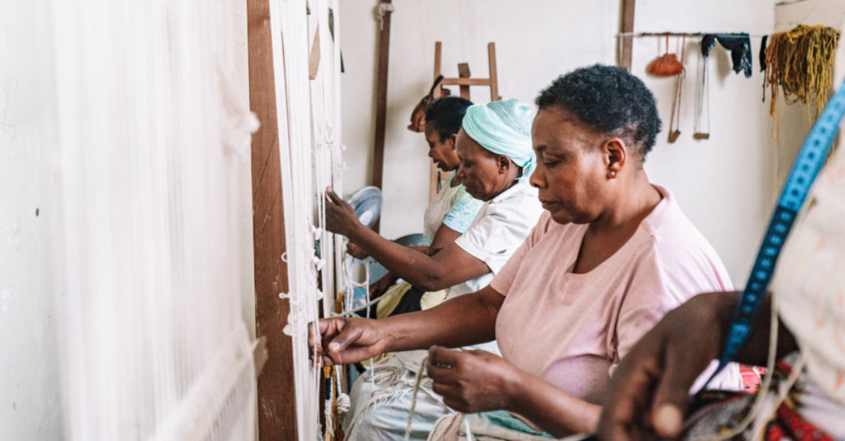 Artisans from Imani Collective working on a project together.