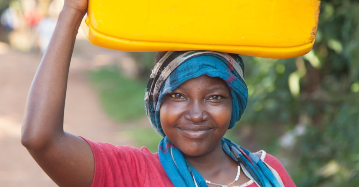 Woman collecting water after a new access point is established