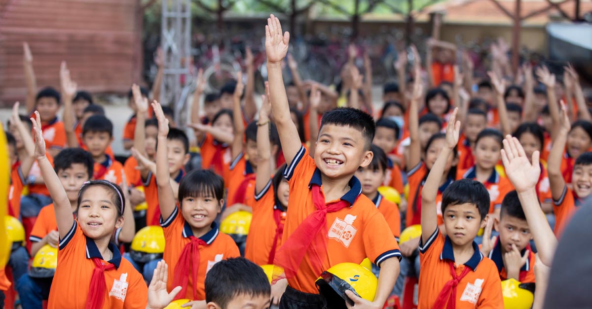 School Children raising their hands