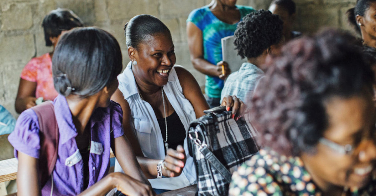 women laugh together in classroom