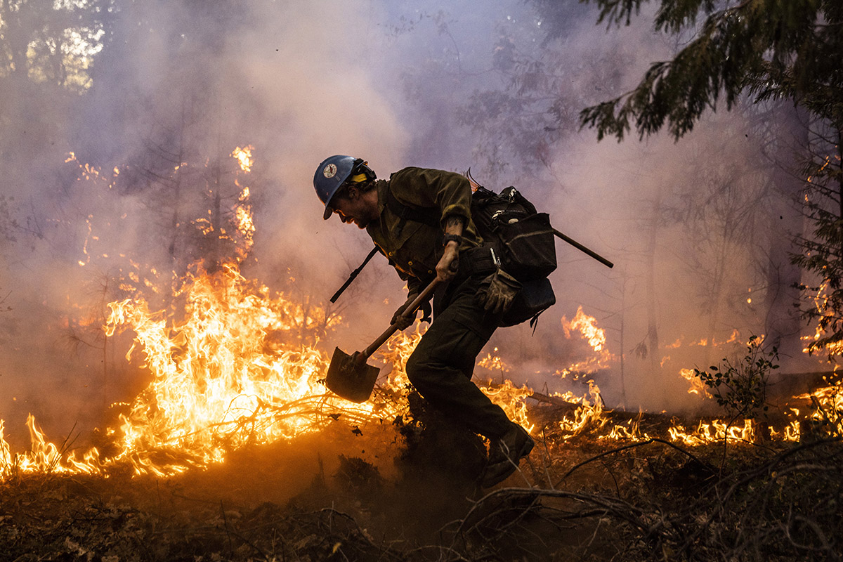 A firefighter working to stop a wildfire.