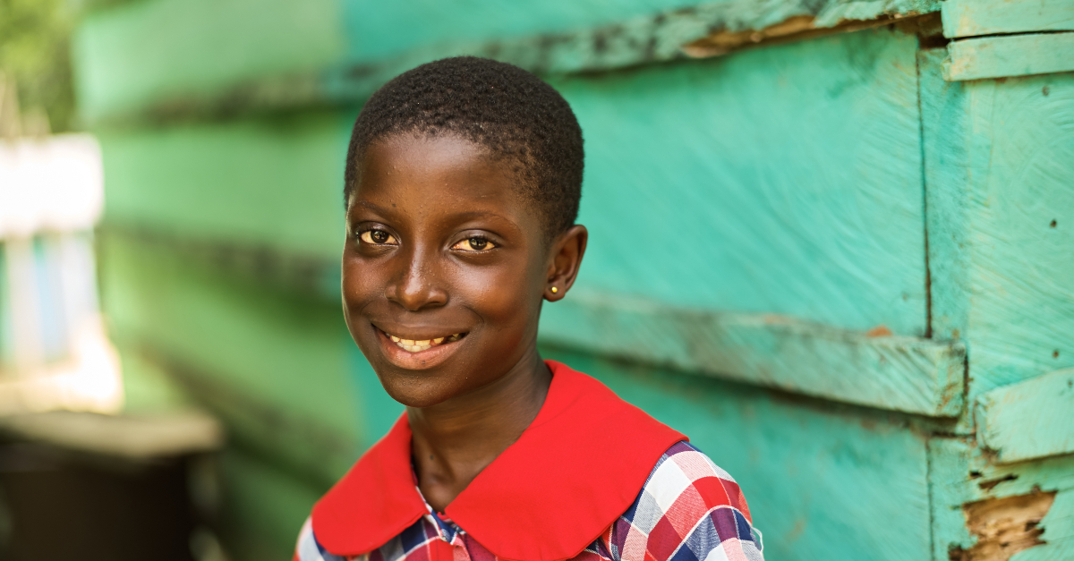 Girl wearing a wide collar dress smiles at the camera - photos of 2022