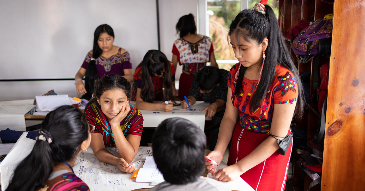 Young women work together in a classroom