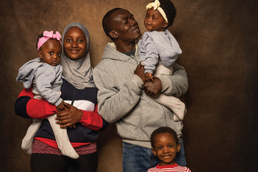 Nikiema Family poses for the camera with their three young children refugee notes