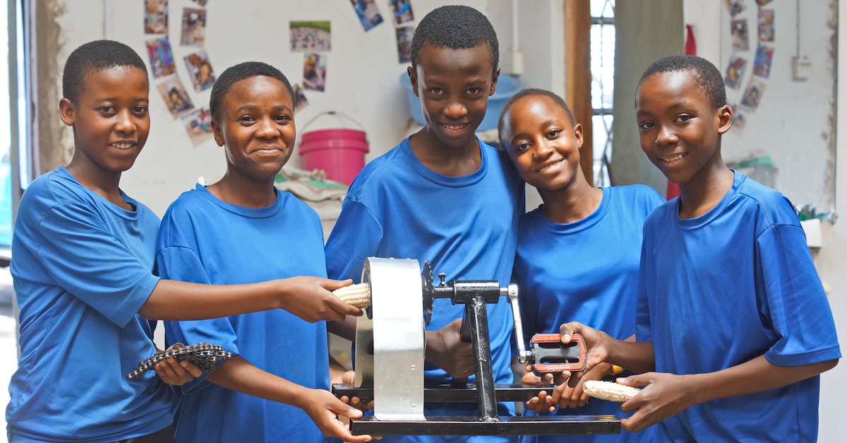 group of young inventors show their invention to help shucking corn shift the paradigm in philanthropy