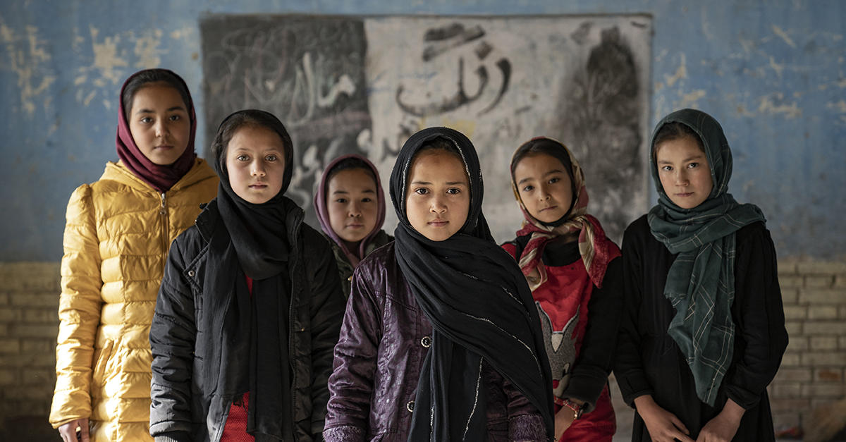 Afghan schoolgirls pose for a photo in a classroom in Kabul, Afghanistan. Photo by Ebrahim Noroozi for the AP.