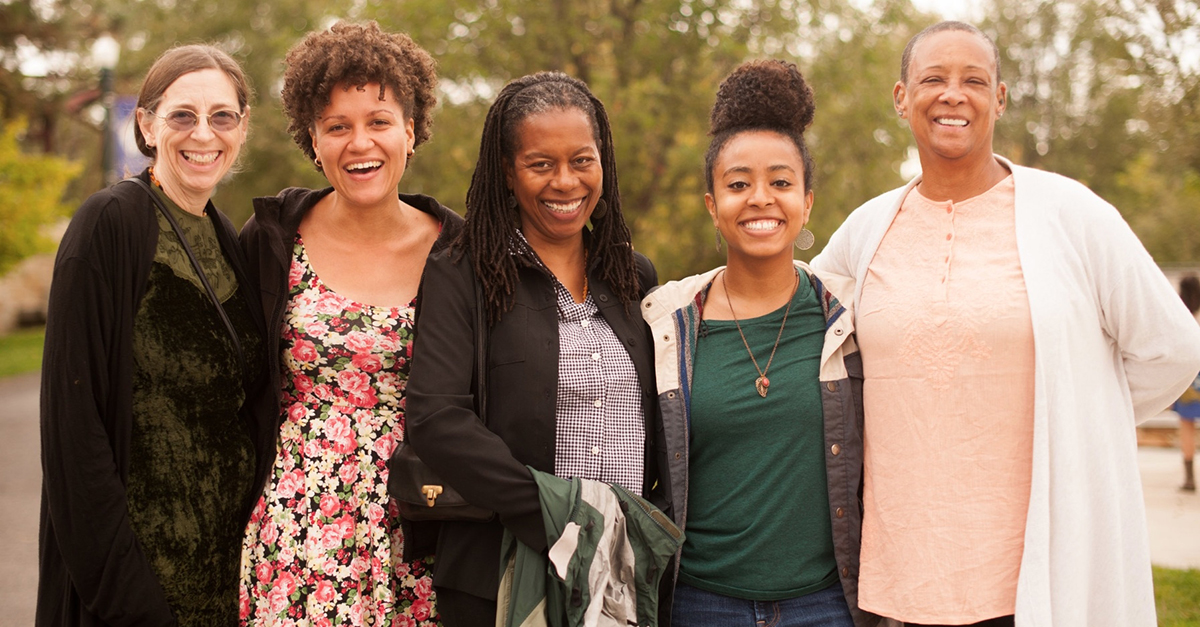 A group of people pose for a photo. Photo by Mercy In Action Vineyard, INC.
