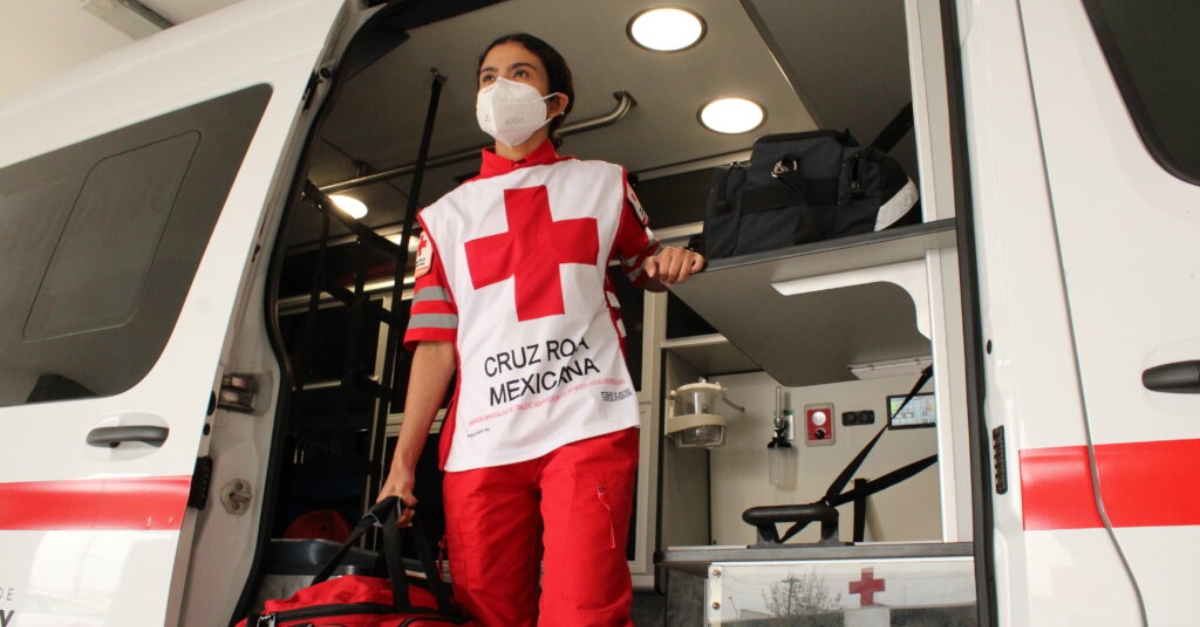 An emergency responder stepping out of a vehicle.