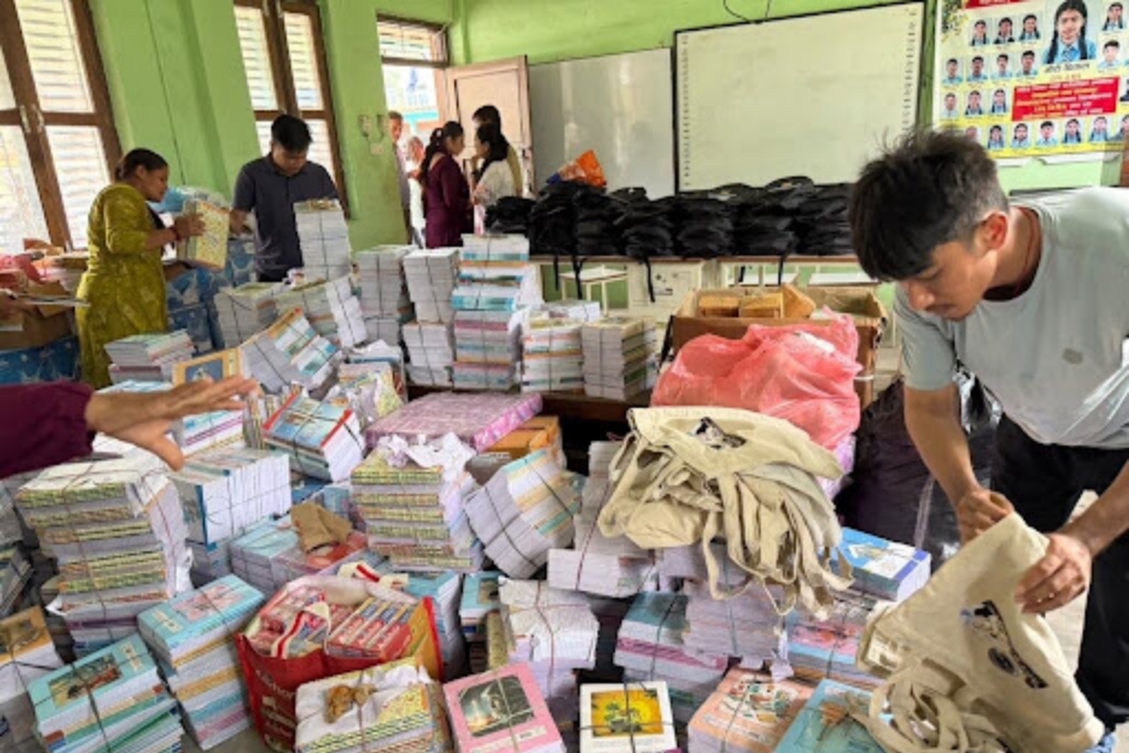 United Community nepal team members organize essential supplies before distribution to flood survivors.