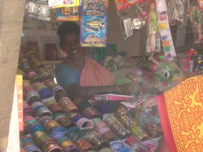 Photo - woman in her shop built with donations through GlobalGiv