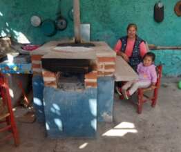 Woman and daughter with their fuel-efficient stove