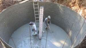 Workers from Curungueo community building cistern