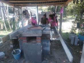 Women from F.Serrato finish fuel-efficient stove