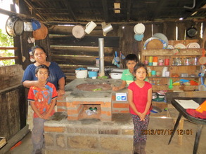 Family with their fuel-efficient stove