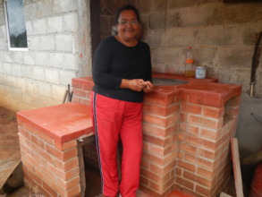 Woman showing of her new fuel-efficient stove