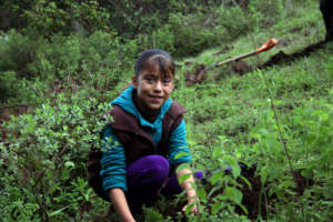 Girl from C.Morales community plants a tree