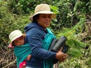 Woman with her child reforesting
