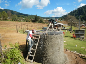 Men from Rosario finish cistern to hold rain-water