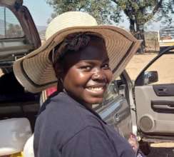 Smiles all around, she has food for her kids!