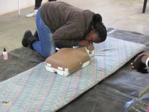 Khanyisa teaching CPR to the children