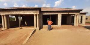 Marcia and her new home, all hand built!