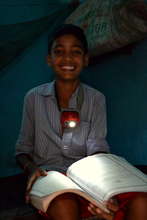Child studying with his NURUlight in Odisha, India