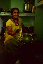 Mother cooking with her NURUlight, Odisha, India