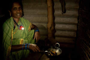 Mother using her NURUlight to cook, Odisha, India