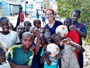 Savannah with soccer balls she donated