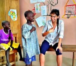 Graciela delights a talibe child