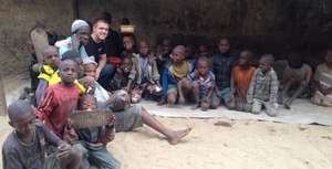 Steven with marabout and children in daara