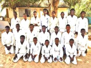 Buaro with his karate class at Maison de la Gare