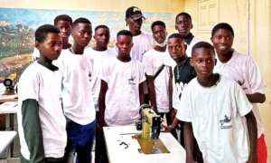 Graduating class with instructor Kalidou, on right