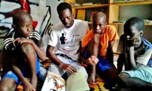 A volunteer reads with children in the library