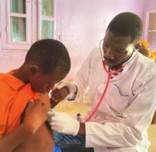 A doctor evaluates a child's cardiac health.