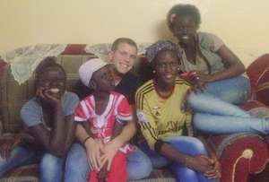 Steven at home with his host family