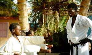 Instructor Buaro guides young karatekas