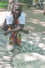 Issa "imagining", at NYC's John Lennon memorial
