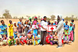 Issa delivers a medical kit to Belel Doba teacher