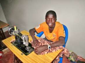 Kalidou learning to sew at Maison de la Gare