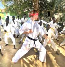 Robbie leading a class in the MDG center