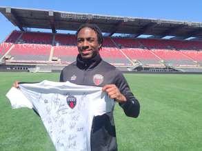 Adrian with jersey signed by Fury players for MDG